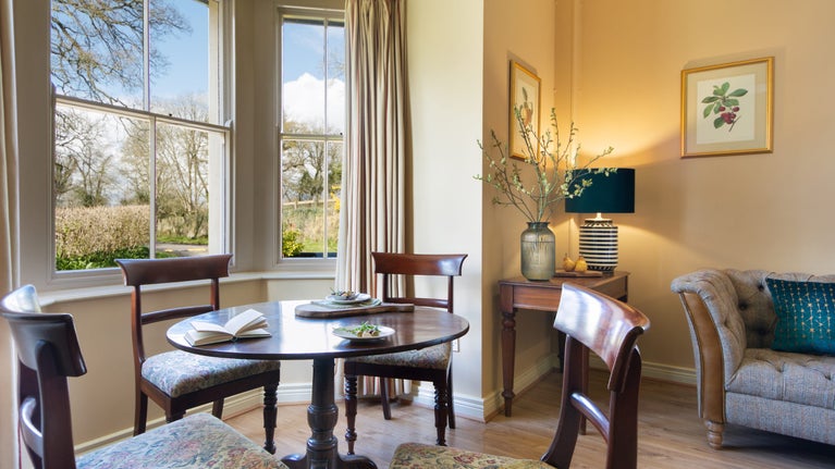 The dining table in the sitting and dining room at Orchard View, Crom, County Fermanagh